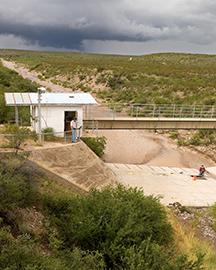 ARS technicians prepare a flume for monitoring runoff from the Walnut Gulch Experimental Watershed.