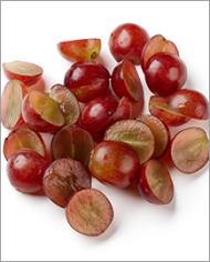 Halved red grapes