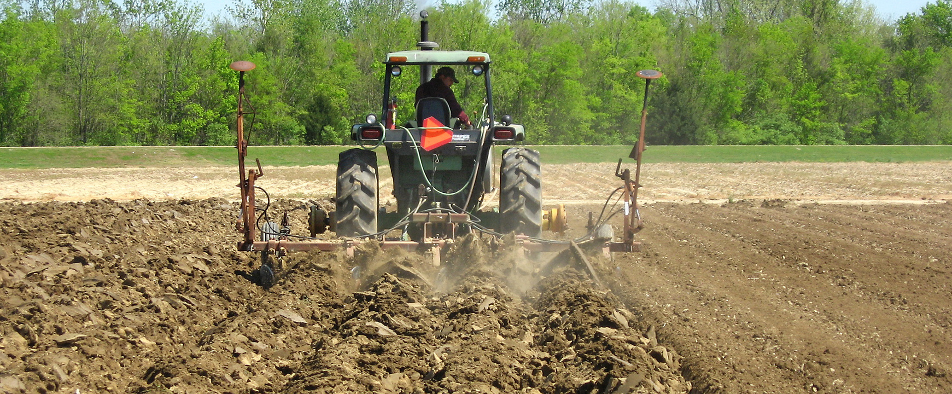 Poultry litter being incorporated into the soil during disking