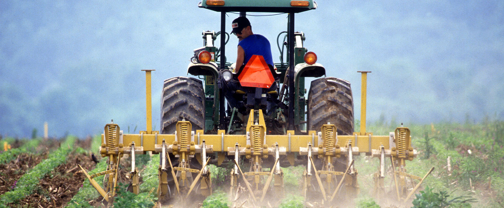 A tractor tilling a field