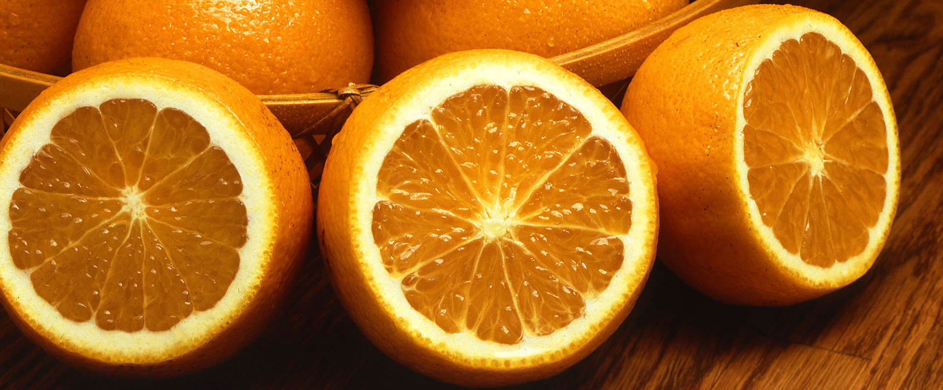Fresh navel oranges sliced open