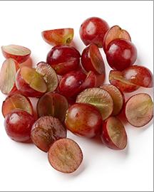 Halved red grapes