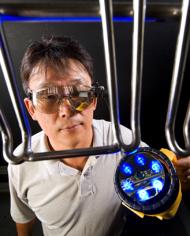 Biophysicist Moon Kim tests a portable imaging device 